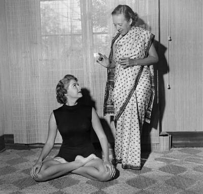 Yogi Indra Devi instructs a student on a yoga position her stu- 1952 Old Photo 2