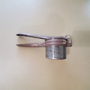 Vintage Metal Press and Juicer with Brown Handle