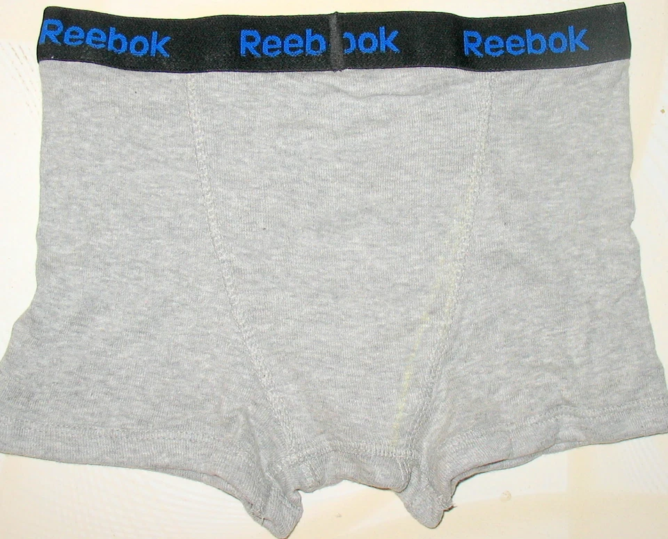 REEBOK - NIÑOS 100% ALGODÓN - GRIS - CALZONCILLOS BOXER - M (8-10) 24"- 25" CINTURA) Foto 2 de 2