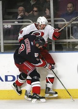 Michal Rozsival New York Rangers boards Kevyn Adams Carolina- Ice Hockey Photo