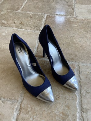 silver and navy blue heels