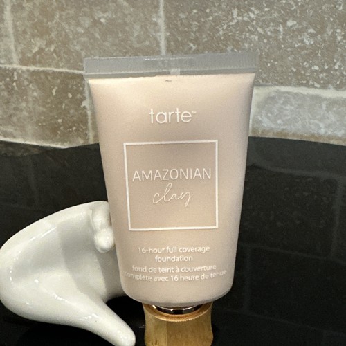 Tarte Amazonian Clay 16-hour full coverage foundation in shade 12B fair beige with matching tube and white ceramic jar.