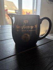 Wade Pottery schwarzer Keramikkrug gebrandmarkt f&uuml;r King George IV Old Scotch Whisky.