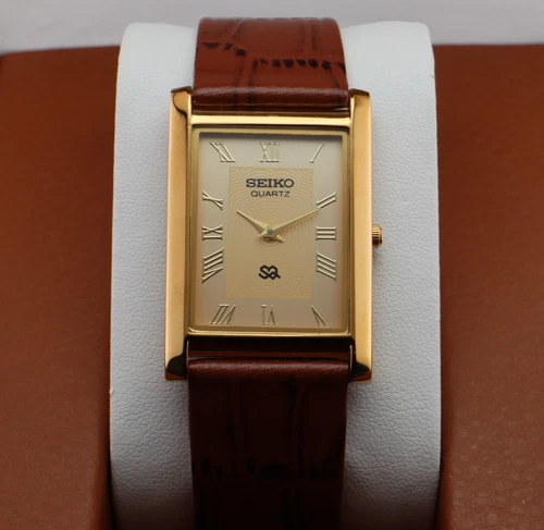 Vintage Seiko Slim Quartz Men's Wrist Watch Beige  Dial with Light Brown Strap.