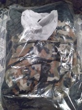 Camo and Black 22 inch length backpack, New See Photos for specifics.