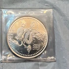 2012- 1 OZ TROY SILVER ROUND YEAR OF THE DRAGON- .999 FINE SILVER