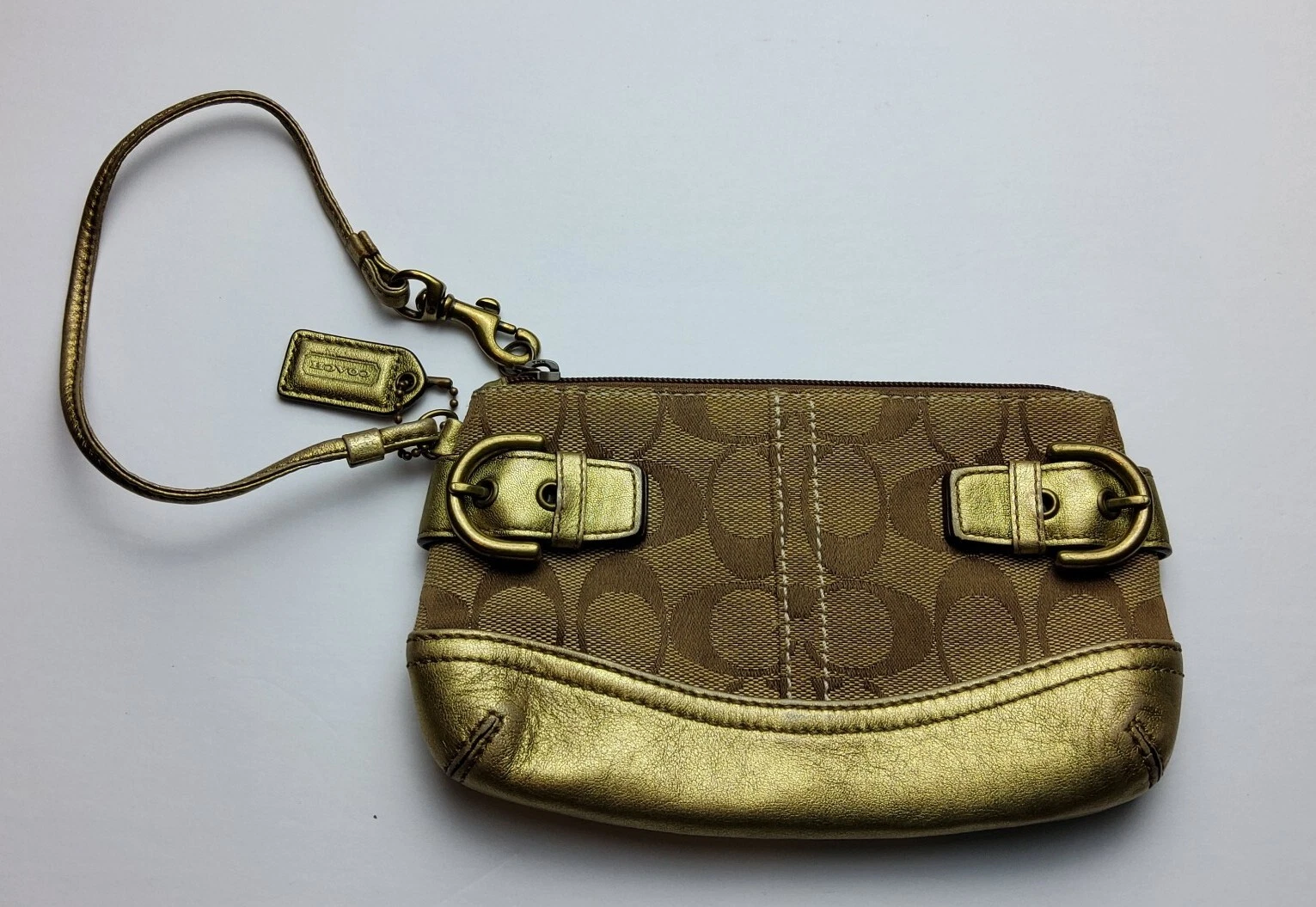 Borsa da polso Coach Signature oro metallizzato finiture in pelle borchie