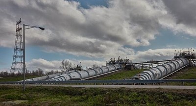 Massive pipes carry water Mississippi River levee cool nearby Wi historic photo