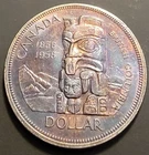 1958 death totem Canadian Silver Dollar Coin.