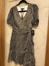 NWT express Mini dress xs animal print ruffled bottom. Brand New Fit and Flare