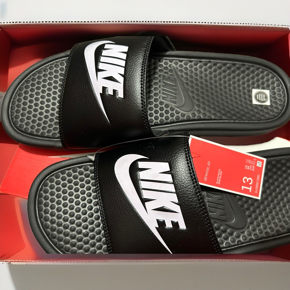 nike benassi slip price