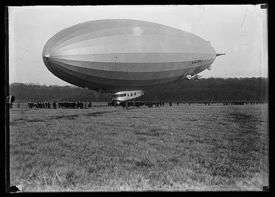 Photo:Dirigible Airship 1920s Large Blimp Crowd Field Photograph