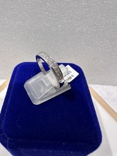 14kt.white gold wedding band with princess cut diamonds size 7,- 2.60 grams.