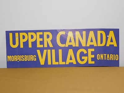 VINTAGE 18'' X 6'' UPPER CANADA MORRISBURG VILLAGE ONTARIO CARDBOARD BUMPER SIGN
