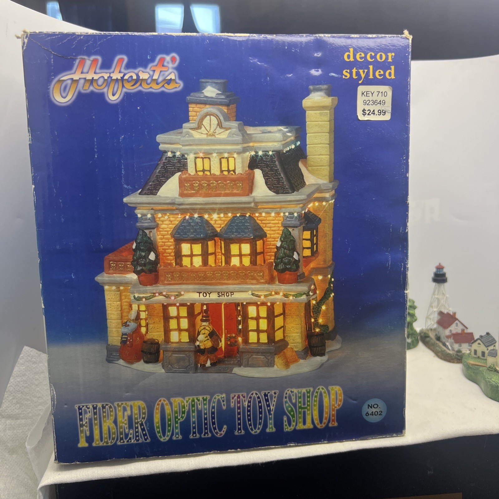 Hofert's Fiber Optic Toy Shop Christmas Village 8 and a half inches tall X8 wide
