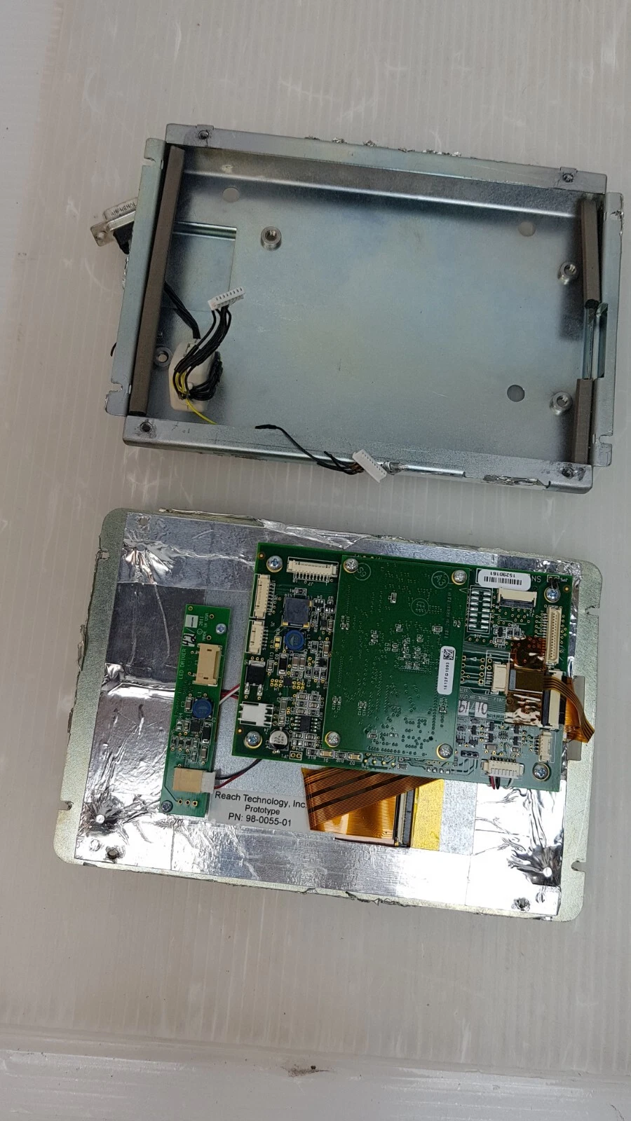 Display opened: empty steel enclosure above, SLCD5 controller and LED driver boards on the panel