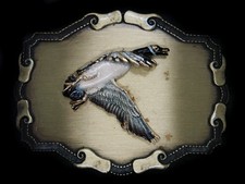 UD03104 VINTAGE 1978 FLYING DUCK ART COMMEMORATIVE RAINTREE BELT BUCKLE