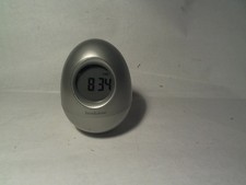 Brookstone Egg Clock. Time, Alarm, Temperature, Date, Timer. Multi-Color Display