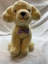 F A O Schwarz - 12" Dog - Cream colored with Purple Bow