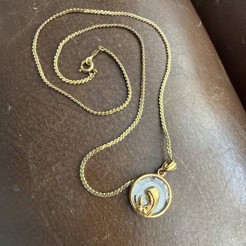 Vintage Monet Praying Virgin Mary Gold Tone Silhouette Clear Pendant Gold Trim