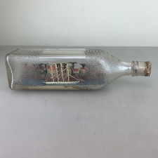 Antique Ship In a Bottle,with scenic background / topical