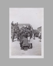 WW2 Photo U.S. Military Trucks Filled With Civilians Man Sitting On Suitcase