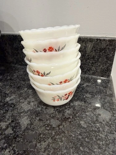 vintage Anchor Hocking Fire-King milk glass custard cups in “Primrose" pattern.