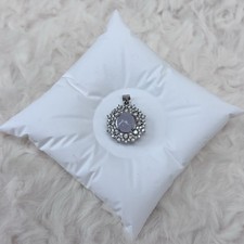 Hand-set jadeite cabochon pendant with a purple cabochon, set in a silver alloy