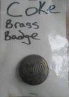 Coca Cola Vintage 1.75" Diameter Round Brass Vendor License Scrollwork Pin Badge