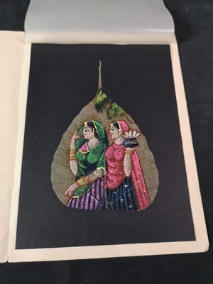 Two women. Indian miniature painting on a Bodhi tree leaf.