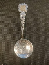 Collectible silver tone spoon from Menorca in Spain & a replica 5 peseta coin