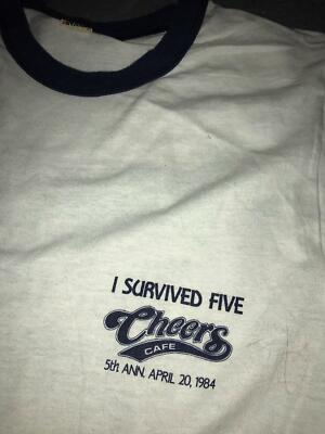 VTG 80S 1984 CHEERS CAFE PUB WE'RE NOT SHOT YET 5TH YEAR RINGER BOSTON SHIRT