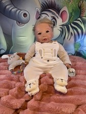 Reborn Soft Cloth Body Baby Doll. Weighted: 5 Pounds 8oz/Length: 21 Inches.