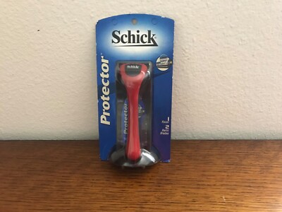 NEW - NEVER USED - MEN S SCHICK PROTECTOR RAZOR W 2 REFILL BLADES - RED HANDLE