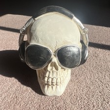 White Skull Collectible Figurine with Black & Silver Headphones