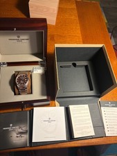 Steel and gold Frederique Constant Highlife automatic cosc brown dial