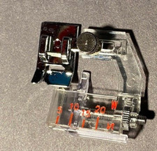 Piedino raccoglitore bias regolabile a scatto Necchi per molti modelli a scatto