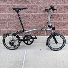 Bicicletta pieghevole leggera in titanio soffiato 4 velocità Brompton T Line