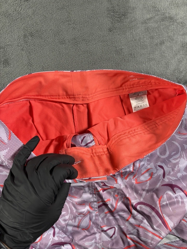 Adidas Falda de Golf Skort Mujer 8 Rendimiento Púrpura Naranja Floral Abstracto Tecnología Foto 3 de 4