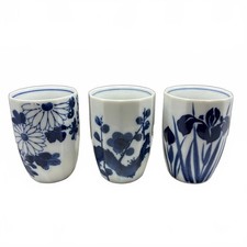 Set of three vintage Japanese blue and white porcelain teacups.