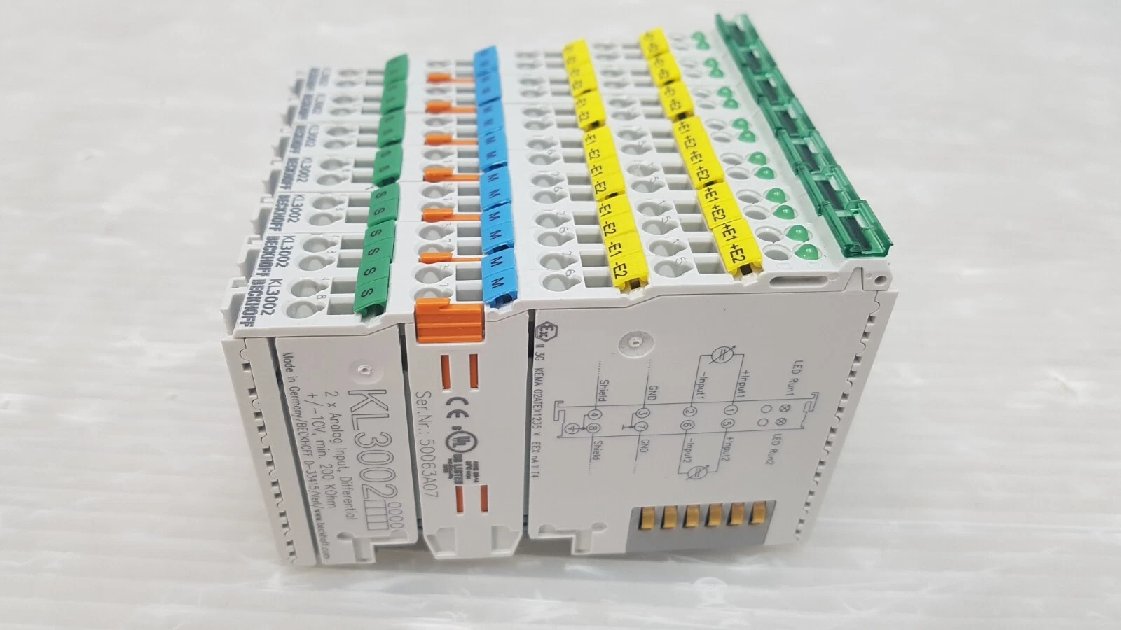 Stack of Beckhoff KL3002 terminals showing the side print and serial label