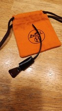 Herm s black leather clochette bag charm includes a leather bell to hold keys
