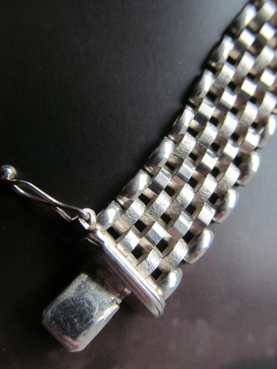 Hallmarked Sterling silver bracelet.  13 mm across.  7 inches long.  22 grams. View 3