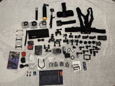 Action Camera And A Bunch Of Accessories With Memory Cards