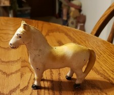 VINTAGE CAST IRON WHITE AND YELLOW HORSE COIN BANK 4'' TALL 5'' LONG