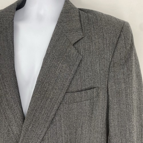 Grey vintage Christian Dior Monsieur suit jacket size 44 with notch lapels, front button closure, and two front flap pockets.