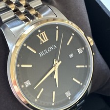 Bulova mens Quartz Gold Tone Case Two Tone Black Dial with Diamonds Watch 98X125