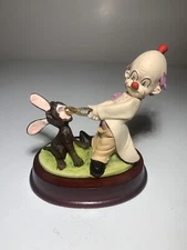 Vintage Clown Figurine. Mischievous Clown Pulling Puppy's Teeth. Resin and Wood.