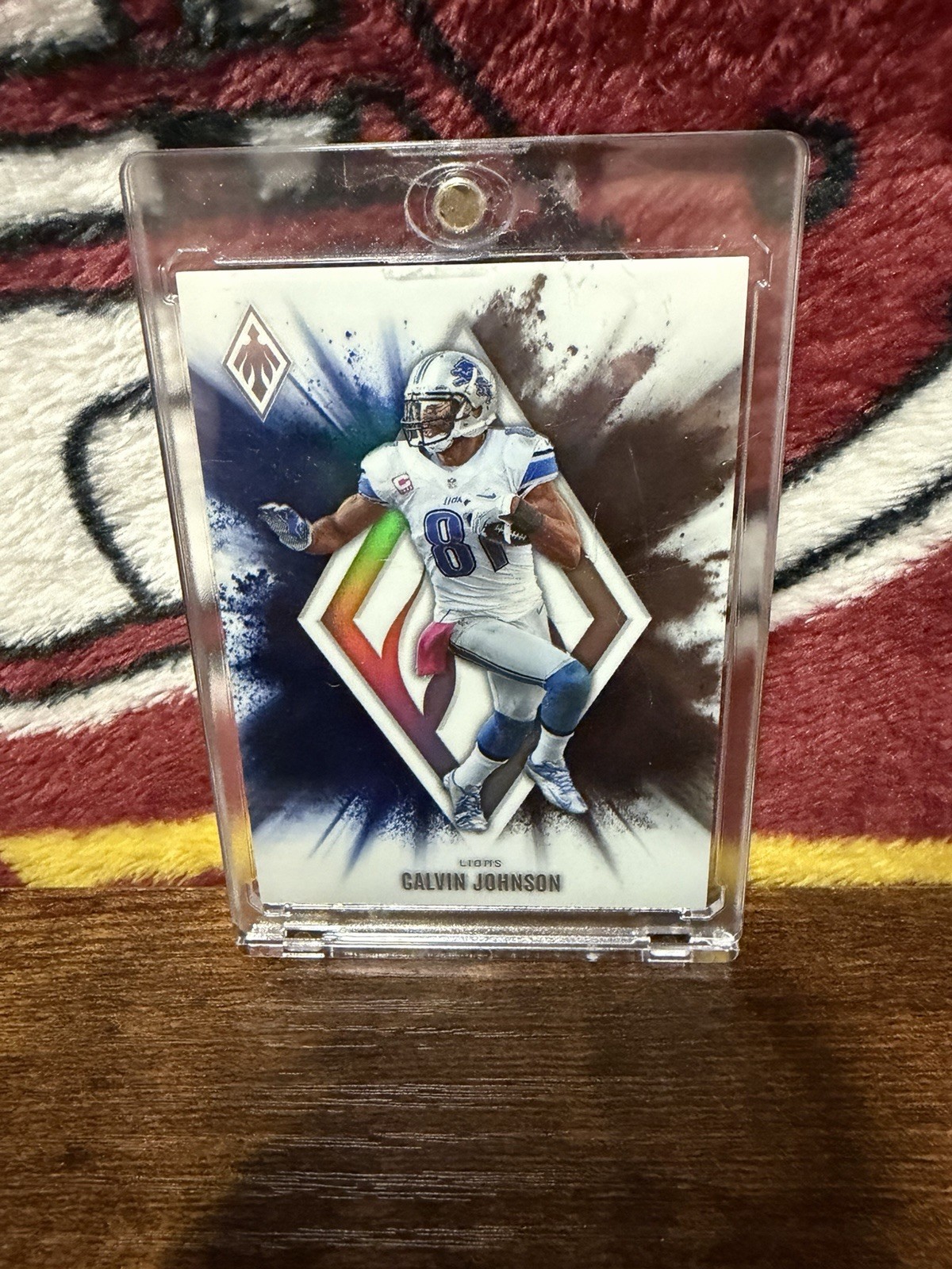 Calvin Johnson #21 (Football Cards 2025 Panini Phoenix Color Blast) — is it worth grading?