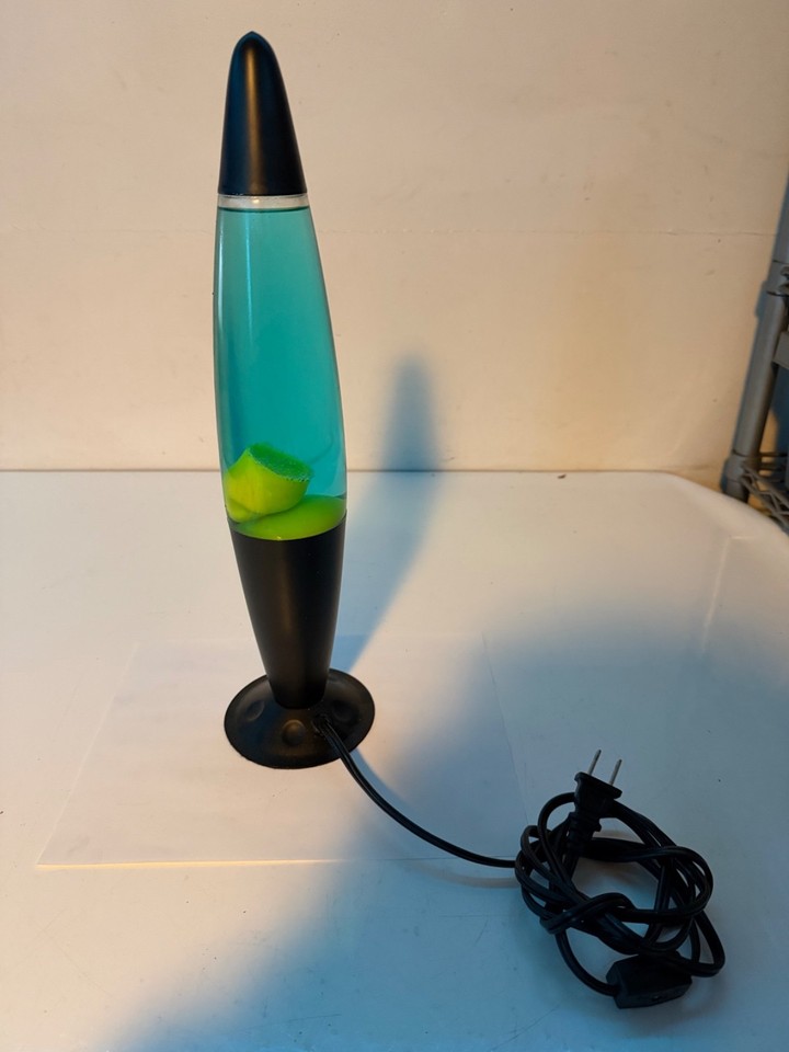 An original working 90s LP-20A lava lamp in the classic green/blue colorway — authentic vintage, not a reproduction.